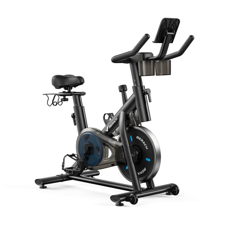 Merach S26B2 indoor exercise bike in a compact home setting