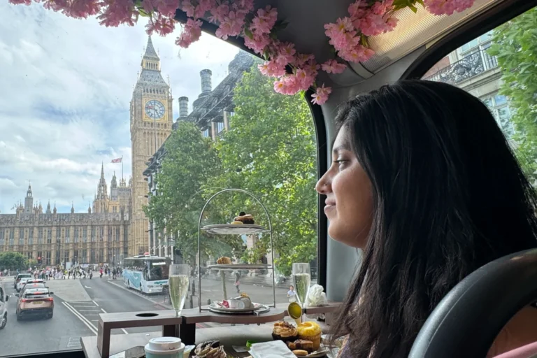 Upper deck seating on Golden Tours afternoon tea bus with London landmark views