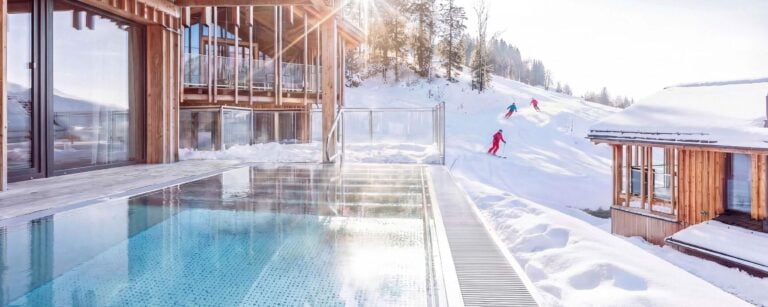 Skiers arriving at an Alps Resorts chalet in Austria