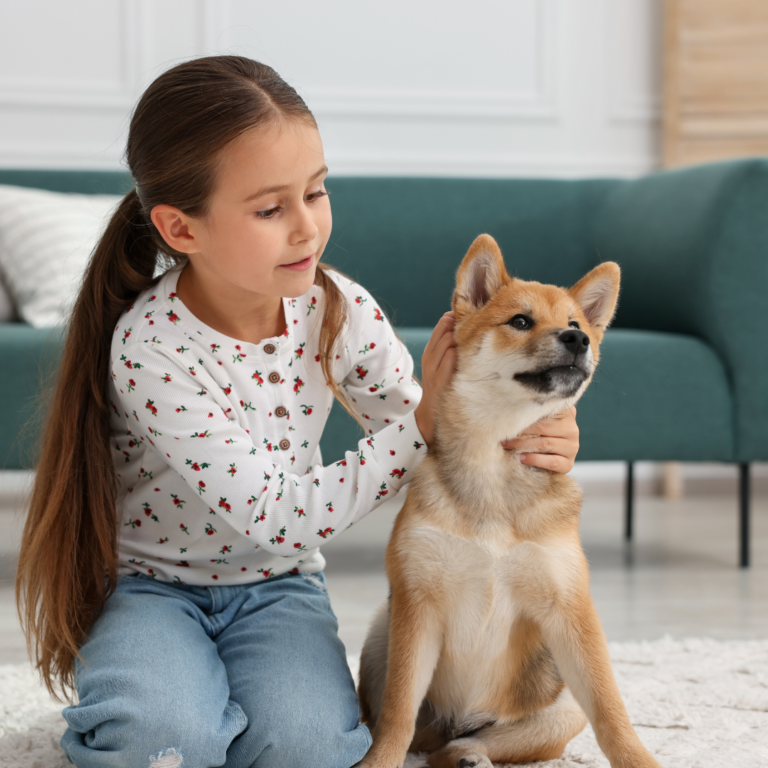Why My Allergic Dog Finally Stopped Itching – A BARF Diet Honest Review Child playing with dog fed on Natuka natural BARF diet